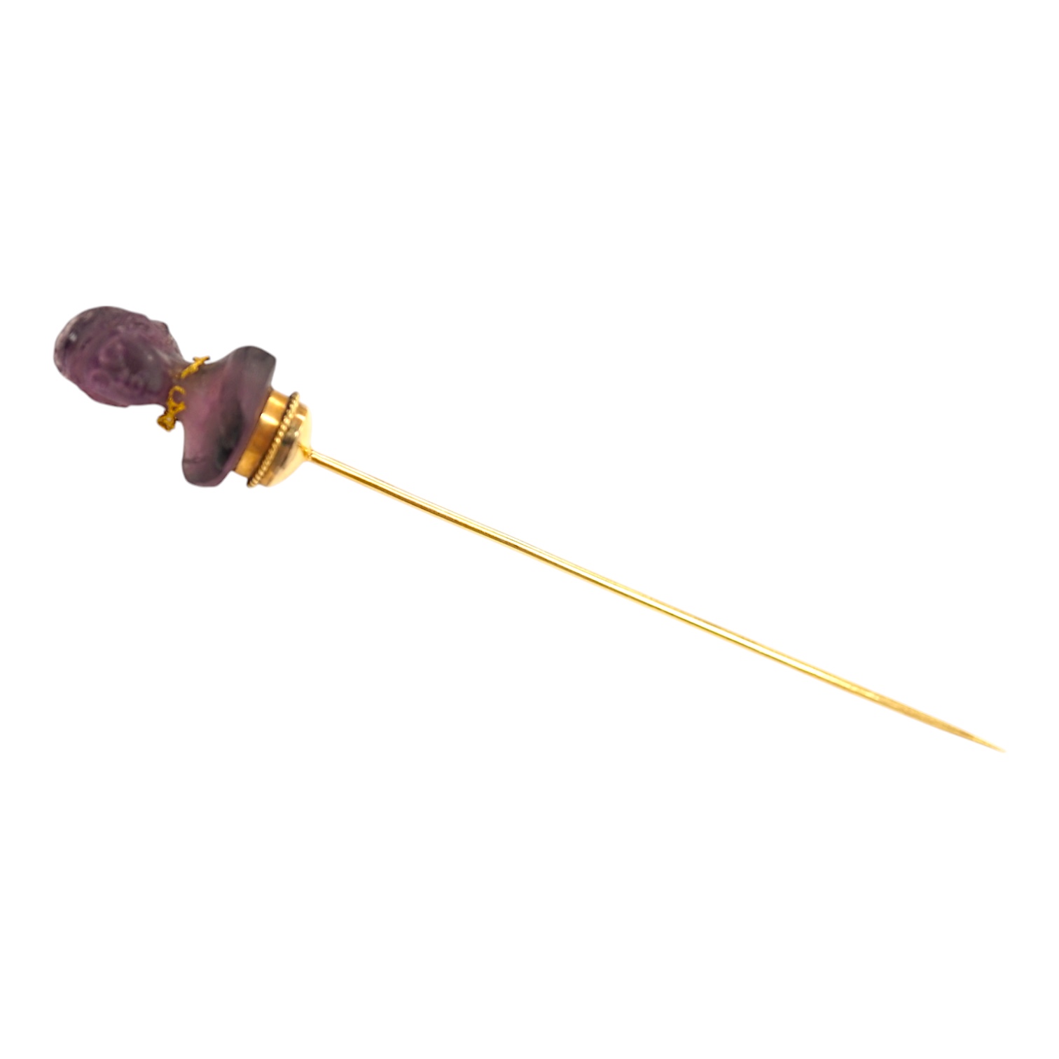 An early 20th century French yellow metal (18ct poincon mark) and amethyst paste set stick pin, the terminal modelled as the bust of a lady, 96mm, gross weight 5.6 grams. Condition - poor to fair